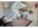 Relaxing sunroom with a glass ceiling, comfortable seating, and natural light at 232 Southampton Ln # 259, Venice, FL 34293