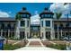 Elegant retail entrance showcasing twin buildings with popular eateries, framed by lush greenery and pedestrian-friendly walkways at 232 Southampton Ln # 259, Venice, FL 34293