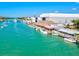 Waterfront restaurants and shops line a beautiful blue canal, ideal for boaters and visitors at 232 Southampton Ln # 259, Venice, FL 34293