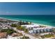 Stunning aerial view of beachfront condos with pool access and pristine sands at 2380 N Beach Rd # 210, Englewood, FL 34223