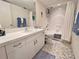 Bathroom featuring a single sink vanity, tile flooring, and shower-tub combo at 2380 N Beach Rd # 210, Englewood, FL 34223