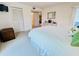 Cozy bedroom with closet, dresser, and access to a private balcony at 2380 N Beach Rd # 210, Englewood, FL 34223