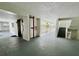 Well-lit hallway with elevator access, stairs, and views of a central courtyard at 2380 N Beach Rd # 210, Englewood, FL 34223