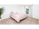 Cozy bedroom with neutral carpet, a double bed, and plenty of natural light at 2408 Bonanza Ln, North Port, FL 34286