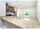 Kitchen featuring granite countertops and stainless-steel sink, and stainless steel appliances at 2408 Bonanza Ln, North Port, FL 34286