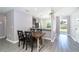 View of kitchen with dining table, granite countertops, stainless steel appliances, and wood cabinets at 2408 Bonanza Ln, North Port, FL 34286