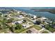 Breathtaking aerial view of waterfront homes highlights the serene location and coastal charm of this lovely neighborhood at 310 Green Dolphin Dr, Placida, FL 33946