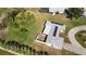 Aerial view of a single-story home with solar panels and a well-maintained yard at 310 Green Dolphin Dr, Placida, FL 33946