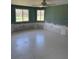 Large bedroom featuring a ceiling fan and dual windows for ample natural light at 310 Green Dolphin Dr, Placida, FL 33946