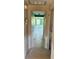 Hallway with tile flooring and an open view to a well-lit room at 310 Green Dolphin Dr, Placida, FL 33946