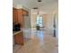 Kitchen featuring tile flooring, a ceiling fan, and a view into a dining area at 310 Green Dolphin Dr, Placida, FL 33946