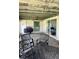 Covered patio with outdoor furniture and a ceiling fan, perfect for entertaining at 310 Green Dolphin Dr, Placida, FL 33946