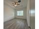 Bright bedroom with a ceiling fan and recessed lights and wood flooring at 311 Yule St, Port Charlotte, FL 33953