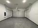 A clean, spacious garage with an epoxy floor and an automatic door opener at 311 Yule St, Port Charlotte, FL 33953