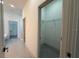 Hallway featuring bathroom, closet, and wood floors leading to other rooms at 311 Yule St, Port Charlotte, FL 33953