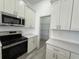 Spacious pantry with wire shelving for maximum storage capacity in the kitchen at 311 Yule St, Port Charlotte, FL 33953