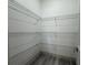 Walk-in pantry with installed wire shelving for organization and storage at 311 Yule St, Port Charlotte, FL 33953