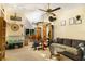 Spacious living room featuring a vaulted ceiling, ceiling fans, and a dining area at 3261 Rogue St, North Port, FL 34291