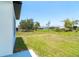 Backyard featuring a grassy lawn and neighborhood views at 398 Sunset N Rd, Rotonda West, FL 33947