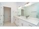 Well-lit bathroom with dual sinks, quartz countertops, and modern fixtures at 398 Sunset N Rd, Rotonda West, FL 33947