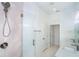 Contemporary bathroom showcasing a glass walk-in shower, sleek fixtures and quartz countertops at 398 Sunset N Rd, Rotonda West, FL 33947