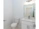Modern half bath with a granite counter and sleek fixtures at 398 Sunset N Rd, Rotonda West, FL 33947