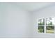 Light-filled bedroom featuring a double-hung window and neutral walls at 398 Sunset N Rd, Rotonda West, FL 33947