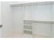 Bright walk-in closet with built-in shelves and hanging rods for optimal storage at 398 Sunset N Rd, Rotonda West, FL 33947