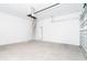 Spacious garage with high ceilings, a door, and an attic entrance at 398 Sunset N Rd, Rotonda West, FL 33947