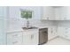 Modern kitchen featuring quartz counters, stainless steel appliances, and ample cabinet space at 398 Sunset N Rd, Rotonda West, FL 33947