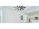 Open-concept living space with a view of the kitchen and a ceiling fan at 398 Sunset N Rd, Rotonda West, FL 33947