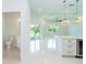 Open-concept living space with tile flooring, modern lighting, and a view of the backyard at 398 Sunset N Rd, Rotonda West, FL 33947