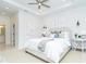 Spacious main bedroom featuring a tray ceiling, tiled floors, and accent lighting at 398 Sunset N Rd, Rotonda West, FL 33947