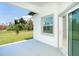 Relaxing covered patio with views of the landscaped backyard and lush surroundings at 398 Sunset N Rd, Rotonda West, FL 33947