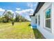 Side yard features a grassy lawn and view of the neighborhood at 398 Sunset N Rd, Rotonda West, FL 33947