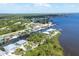 Aerial view showcasing the waterfront homes along the canal leading to the open water at 4219 Spire St, Port Charlotte, FL 33981