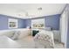 Charming bedroom with two twin beds, blue walls and white trim at 4219 Spire St, Port Charlotte, FL 33981