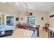 Dining room with view of outdoor deck and lake at 4219 Spire St, Port Charlotte, FL 33981