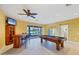 Entertaining game room featuring a pool table, wet bar, and waterfront views at 4219 Spire St, Port Charlotte, FL 33981