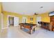 Bright game room with a pool table, bar area, and access to stairs at 4219 Spire St, Port Charlotte, FL 33981
