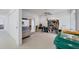 Well-lit garage with storage and side-by-side refrigerator at 4219 Spire St, Port Charlotte, FL 33981