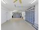 Spacious multi-car garage with high ceilings and multiple garage doors for ample storage at 4219 Spire St, Port Charlotte, FL 33981
