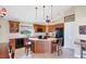 Eat-in kitchen featuring a breakfast bar, wooden cabinets, a pantry sign and black appliances at 4219 Spire St, Port Charlotte, FL 33981