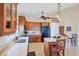 Kitchen featuring wooden cabinets, an island with seating and views from the bright window at 4219 Spire St, Port Charlotte, FL 33981