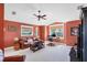 Comfortable living room with leather furniture and large windows at 4219 Spire St, Port Charlotte, FL 33981