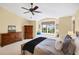 Bright main bedroom with a window seat and lake views at 4219 Spire St, Port Charlotte, FL 33981