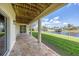 Covered outdoor patio with tile flooring and canal views in a desirable community at 4219 Spire St, Port Charlotte, FL 33981