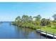 Picturesque waterfront view showcases the canal and private boat dock access at 4219 Spire St, Port Charlotte, FL 33981