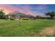Spacious, fenced-in backyard with a screened lanai; enjoy outdoor living at its finest at 4225 Fairway Dr, North Port, FL 34287