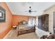 Cozy bedroom with a ceiling fan, window, and inviting bed, providing a comfortable and peaceful retreat at 4225 Fairway Dr, North Port, FL 34287